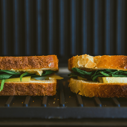 two sandwiches on a small electric grill