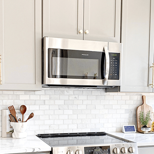 bright, white kitchen with a microwave